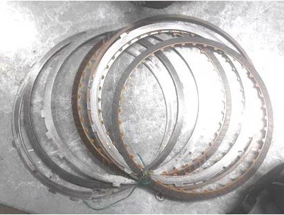 Фото 34. Диски муфты (барабана, пакета) реверса (задней передачи)