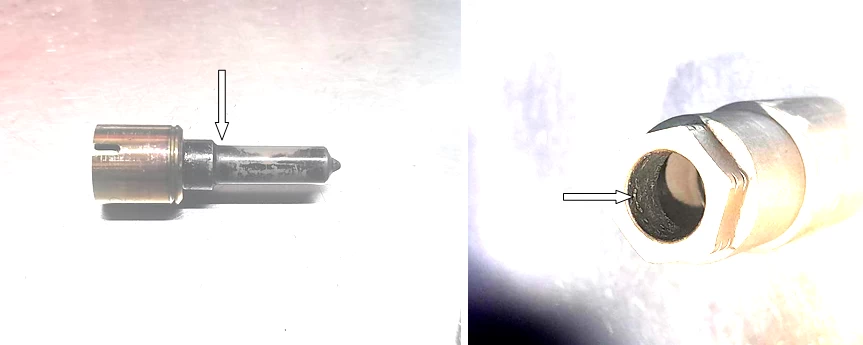 Фото 13,14. Нагарообразные наложения на распылителе и внутри него (показаны белой стрелкой)