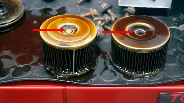 Фото 7. Разная высота фильтрующего элемента и диаметр перепускного клапана (показан стрелками)